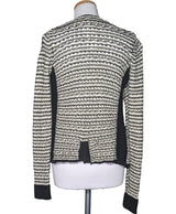 La garantie Once Again : 439256 vêtements d'occasion de marque en état irréprochable.