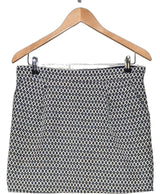 La garantie Once Again : 560074 vêtements d'occasion de marque en état irréprochable.