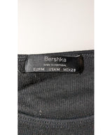 La garantie Once Again : 560437 vêtements d'occasion de marque en état irréprochable.