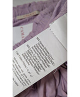 La garantie Once Again : 560876 vêtements d'occasion de marque en état irréprochable.