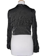 La garantie Once Again : 560925 vêtements d'occasion de marque en état irréprochable.