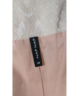 La garantie Once Again : 561108 vêtements d'occasion de marque en état irréprochable.