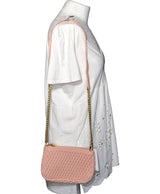 La garantie Once Again : 561616 vêtements d'occasion de marque en état irréprochable.
