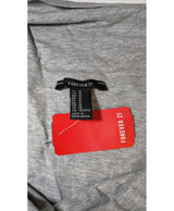 La garantie Once Again : 562411 vêtements d'occasion de marque en état irréprochable.