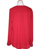 La garantie Once Again : 562477 vêtements d'occasion de marque en état irréprochable.