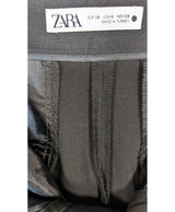 La garantie Once Again : 563176 vêtements d'occasion de marque en état irréprochable.