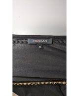 La garantie Once Again : 563820 vêtements d'occasion de marque en état irréprochable.