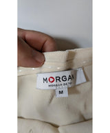 La garantie Once Again : 564234 vêtements d'occasion de marque en état irréprochable.