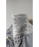 La garantie Once Again : 564528 vêtements d'occasion de marque en état irréprochable.