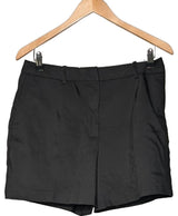 La garantie Once Again : 564990 vêtements d'occasion de marque en état irréprochable.