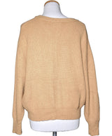 La garantie Once Again : 565125 vêtements d'occasion de marque en état irréprochable.
