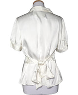 La garantie Once Again : 565235 vêtements d'occasion de marque en état irréprochable.