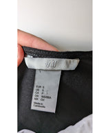 La garantie Once Again : 565531 vêtements d'occasion de marque en état irréprochable.