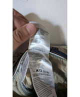 La garantie Once Again : 569309 vêtements d'occasion de marque en état irréprochable.