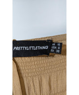 La garantie Once Again : 569718 vêtements d'occasion de marque en état irréprochable.