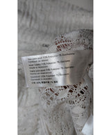 La garantie Once Again : 570849 vêtements d'occasion de marque en état irréprochable.