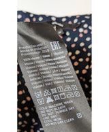 La garantie Once Again : 570950 vêtements d'occasion de marque en état irréprochable.