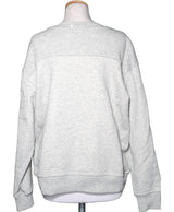 La garantie Once Again : 571117 vêtements d'occasion de marque en état irréprochable.