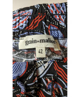 La garantie Once Again : 571142 vêtements d'occasion de marque en état irréprochable.