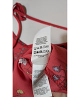La garantie Once Again : 571697 vêtements d'occasion de marque en état irréprochable.