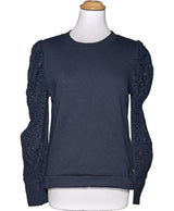 La garantie Once Again : 573901 vêtements d'occasion de marque en état irréprochable.