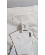 La garantie Once Again : 574216 vêtements d'occasion de marque en état irréprochable.