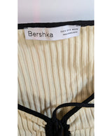 La garantie Once Again : 574322 vêtements d'occasion de marque en état irréprochable.