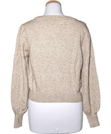 La garantie Once Again : 574423 vêtements d'occasion de marque en état irréprochable.