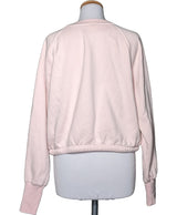La garantie Once Again : 574433 vêtements d'occasion de marque en état irréprochable.