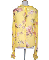 La garantie Once Again : 574491 vêtements d'occasion de marque en état irréprochable.