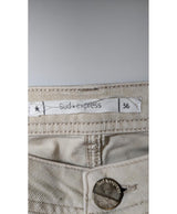 La garantie Once Again : 574674 vêtements d'occasion de marque en état irréprochable.