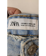 La garantie Once Again : 575542 vêtements d'occasion de marque en état irréprochable.