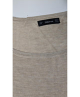 La garantie Once Again : 577820 vêtements d'occasion de marque en état irréprochable.