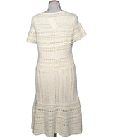 La garantie Once Again : 578320 vêtements d'occasion de marque en état irréprochable.