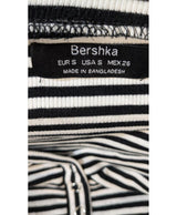La garantie Once Again : 578408 vêtements d'occasion de marque en état irréprochable.
