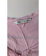 La garantie Once Again : 578849 vêtements d'occasion de marque en état irréprochable.