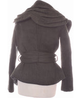 La garantie Once Again : 458327 vêtements d'occasion de marque en état irréprochable.