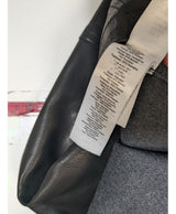La garantie Once Again : 540523 vêtements d'occasion de marque en état irréprochable.