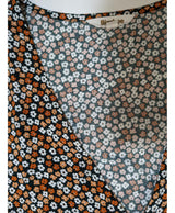 La garantie Once Again : 540596 vêtements d'occasion de marque en état irréprochable.