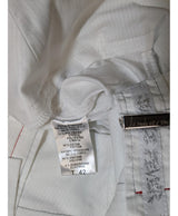 La garantie Once Again : 547843 vêtements d'occasion de marque en état irréprochable.
