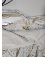 La garantie Once Again : 547864 vêtements d'occasion de marque en état irréprochable.