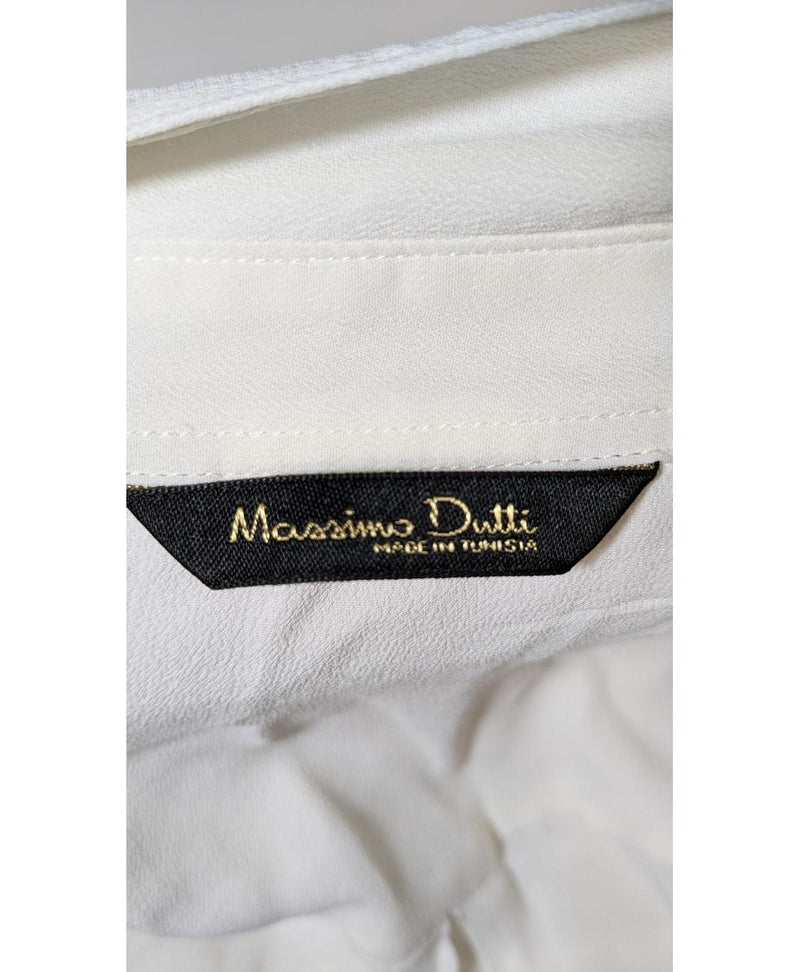 La garantie Once Again : 560188 vêtements d'occasion de marque en état irréprochable.