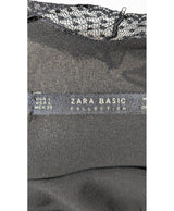 La garantie Once Again : 560196 vêtements d'occasion de marque en état irréprochable.