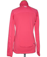 La garantie Once Again : 560640 vêtements d'occasion de marque en état irréprochable.
