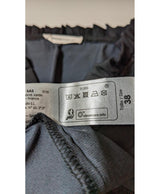 La garantie Once Again : 561185 vêtements d'occasion de marque en état irréprochable.