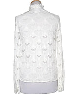 La garantie Once Again : 561685 vêtements d'occasion de marque en état irréprochable.