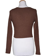 La garantie Once Again : 562562 vêtements d'occasion de marque en état irréprochable.
