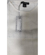 La garantie Once Again : 563235 vêtements d'occasion de marque en état irréprochable.