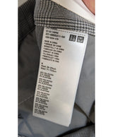 La garantie Once Again : 563604 vêtements d'occasion de marque en état irréprochable.