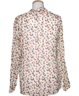 La garantie Once Again : 563941 vêtements d'occasion de marque en état irréprochable.